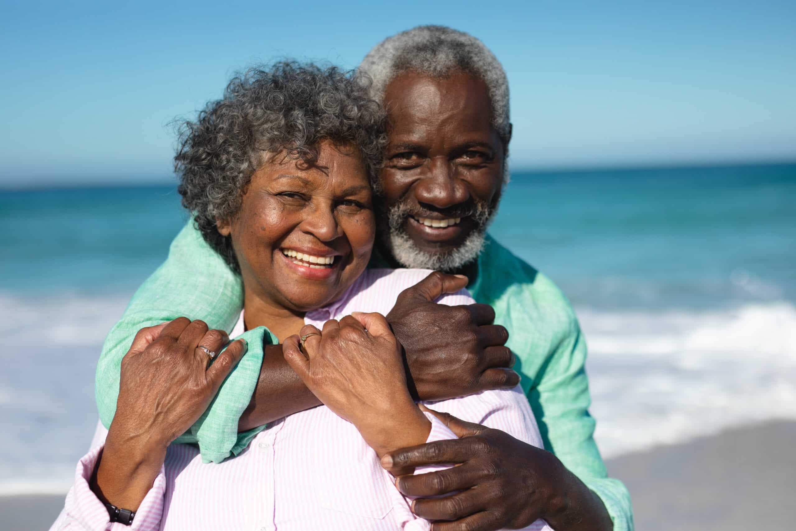 old couple enjoy their life moving decision to the beach
